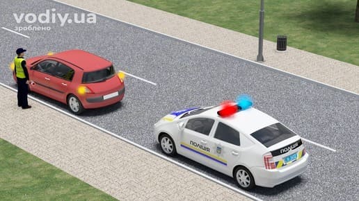 Поліцейський зупинив червоний автомобіль, патрульне авто з увімкненими синім та червоним проблисковими маячками біля краю проїзної частини.