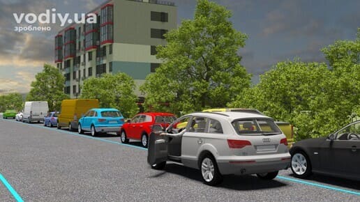 Сірий автомобіль зупинився другим рядом на проїзній частині вздовж лінії припаркованих машин біля краю дороги.