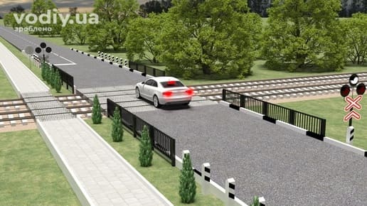 Зупинка автомобіля на залізничному переїзді, дорожні знаки 1.29 «Одноколійна залізниця», 1.30 «Багатоколійна залізниця», світлофор на переїзді