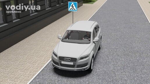 Зупинка автомобіля перед дорожнім знаком 5.38.1 «Пішохідний перехід» на вузькій дорозі.