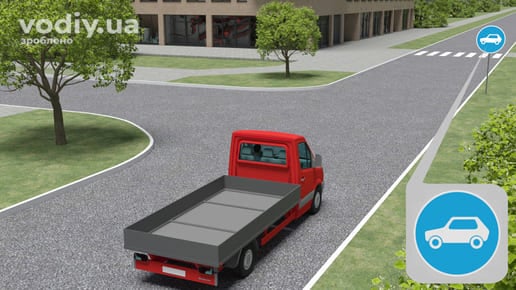 Дорожній знак 4.11 «Рух легкових автомобілів», вантажний автомобіль перед перехрестям у населеному пункті.