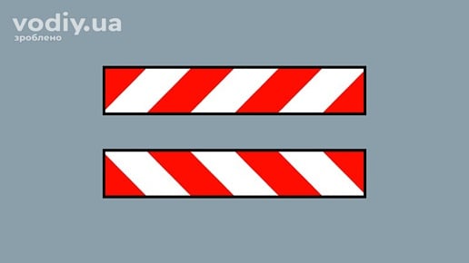 Розпізнавальний знак транспортного засобу у вигляді світлоповертальної стрічки з червоними та білими смугами під кутом 45 градусів.
