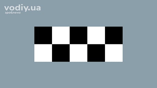 Розпізнавальний знак Таксі у вигляді композиції з чорних та білих квадратів, розташованих у шаховому порядку.