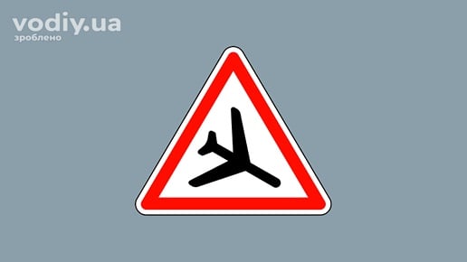 Попереджувальний дорожній знак 1.18 «Низьколітаючі літаки»