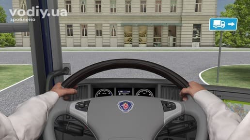 Дорожній знак 5.31.2 «Напрямок руху для вантажних автомобілів», поворот ліворуч на перехресті, вид з кабіни вантажівки.