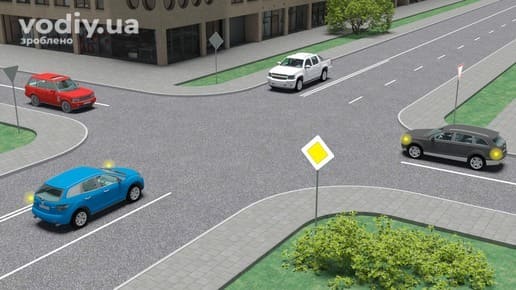 Синій автомобіль з увімкненим покажчиком повороту на перехресті, дорожні знаки 2.3 «Головна дорога» та 2.1 «Дати дорогу», зустрічний білий пікап.