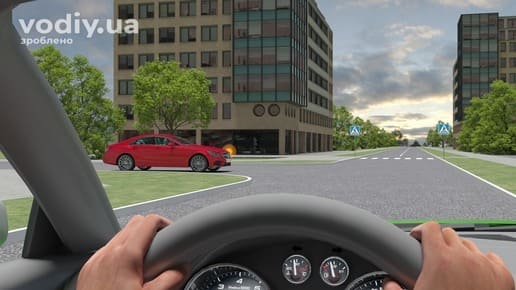 Червоний автомобіль на нерегульованому перехресті рівнозначних доріг, дорожні знаки 5.38.1 та 5.38.2 «Пішохідний перехід», вид з місця водія.