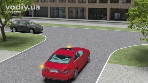 Червоний та чорний автомобілі на нерегульованому перехресті рівнозначних доріг, у червоного авто ввімкнено лівий покажчик повороту.