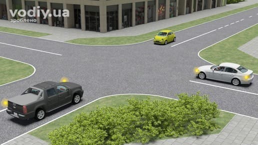 Чорний, білий та жовтий автомобілі на нерегульованому перехресті рівнозначних доріг, черговість проїзду за правилом правої руки.