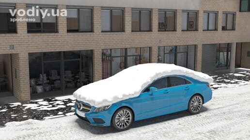 Блакитний автомобіль повністю вкритий товстим шаром снігу на даху, капоті та склі перед початком руху взимку.