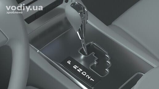 Селектор автоматичної коробки передач у положенні Parking, режими АКПП на центральній консолі автомобіля.