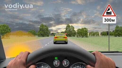 Обгін перед залізничним переїздом, дорожні знаки: 1.28 «Залізничний переїзд без шлагбаума», 7.1.1 «Відстань до об’єкта».