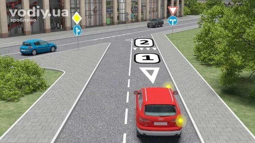 Червоний автомобіль перед перехрестям, дорожні знаки 2.1, 4.6, розмітка 1.13 та розмітка 1.20 на смузі руху. Місце зупинки щоб дати дорогу.